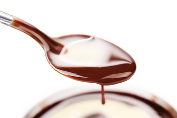 Spoon with liquid chocolate.