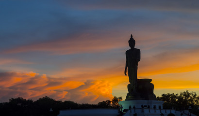 Biggest buddha statue in sunset background