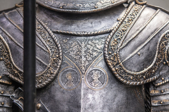 Detail of a medieval knight armor with sword
