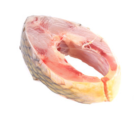 Raw carp fish steak closeup.