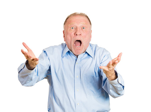 Portrait of a surprised older, senior man on white background 