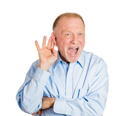 Portrait nosy senior man listening to shocking rumours