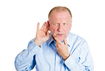 Portrait nosy senior man listening to shocking rumours