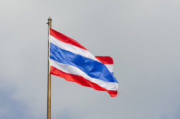 Image of waving Thai flag of Thailand with blue sky background