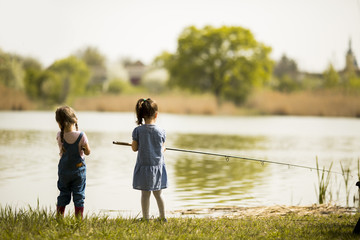 Two little girls fishing