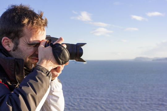 Young adult photographing