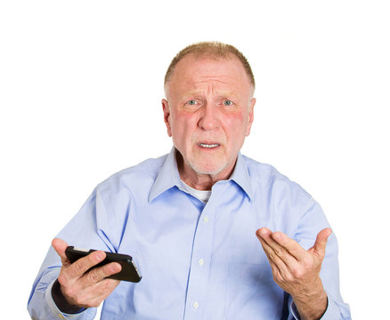 Old man receiving bad news on cellphone device