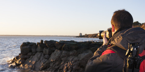 Young adult photographing