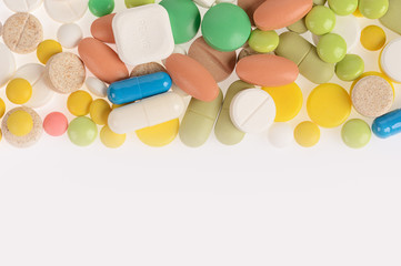 Stack of different pills isolated on white background