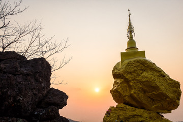 pagoda on rock stone and sunset time