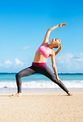 Athletic Fitness Woman Stretching At the Beach,