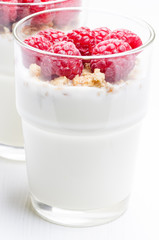 Raspberry desert in glass vertical close up