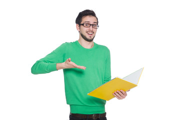Young student with book on white