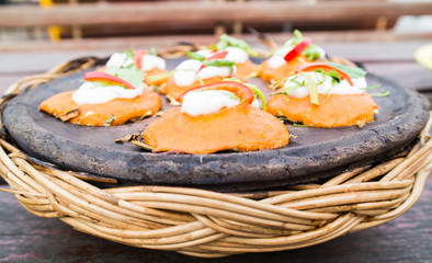 Baked curried fish paste on earthenware
