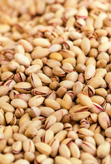 Pistachios background close up. Pistachio Nuts Pile on a market.
