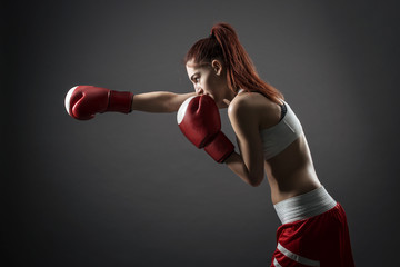 Boxing woman binds the bandage on his hand, before training