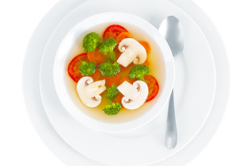 Mushroom soup with vegetables on white background