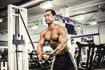 Fototapeta na wymiar Muscular man exercising