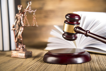 Lady of justice, wooden & gold gavel and books on wooden table - 63666109