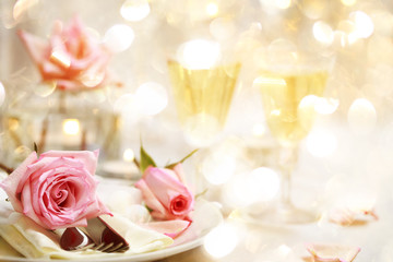 Dinner table with beautiful pink roses