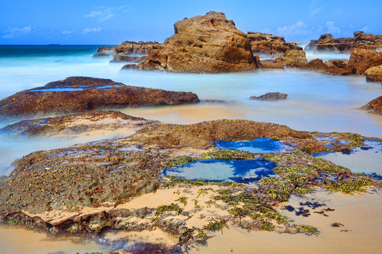 Long exposure rocks and rock pools at low tide