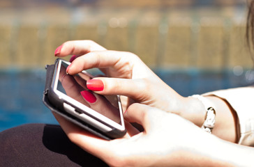 female fingers touching smartphone screen