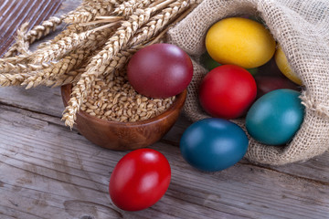 Painted eggs in a linen sack for the celebration of Easter