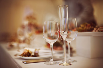 Glasses set with drinks and dishes in restaurant