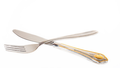 Knife and fork on a white background
