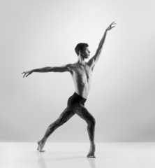 Sporty and athletic ballet dance. Black and white image.