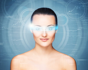 Portrait of a sensual woman with virtual glasses on blue