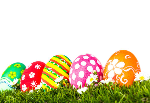 Easter Eggs with flower on Fresh Green Grass over white backgrou