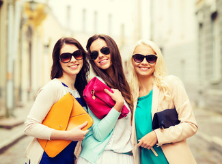 beautiful girls with bags in the ctiy