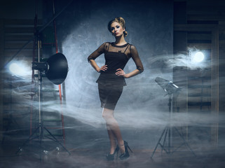 Woman in fashion dress over glamour background