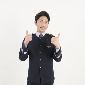 Cheerful asian airline pilot