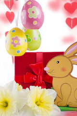 Easter decoration with rabbit, narcissus and eggs