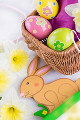 Easter decoration with rabbit, eggs and tulips