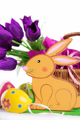 Easter decoration with rabbit, eggs and tulips