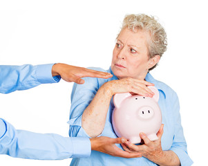 Don't steal my savings. Senior woman protecting piggy bank