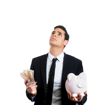 Save or spend? man thinking planning how to manage money