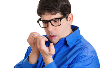 OCD. Man with obsessive compulsive disorder checking his nails