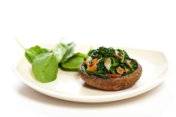 Stuffed mushroom with spinach and bacon. Selective focus. Macro.