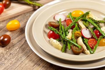 Vegetable salad with asparagus and tomato