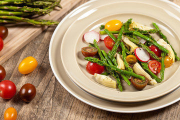 Vegetable salad with asparagus and tomato