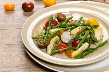 Vegetable salad with asparagus and tomato