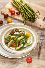 Vegetable salad with asparagus and tomato