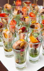 Various snacks in shot glasses