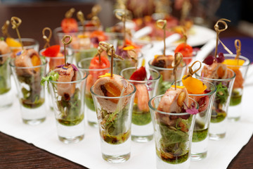 Various snacks in shot glasses