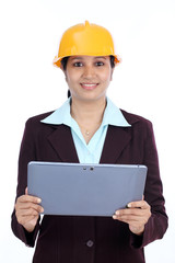 Young Indian female engineer with tablet computer