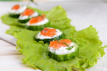 Delicious canapes on table close-up